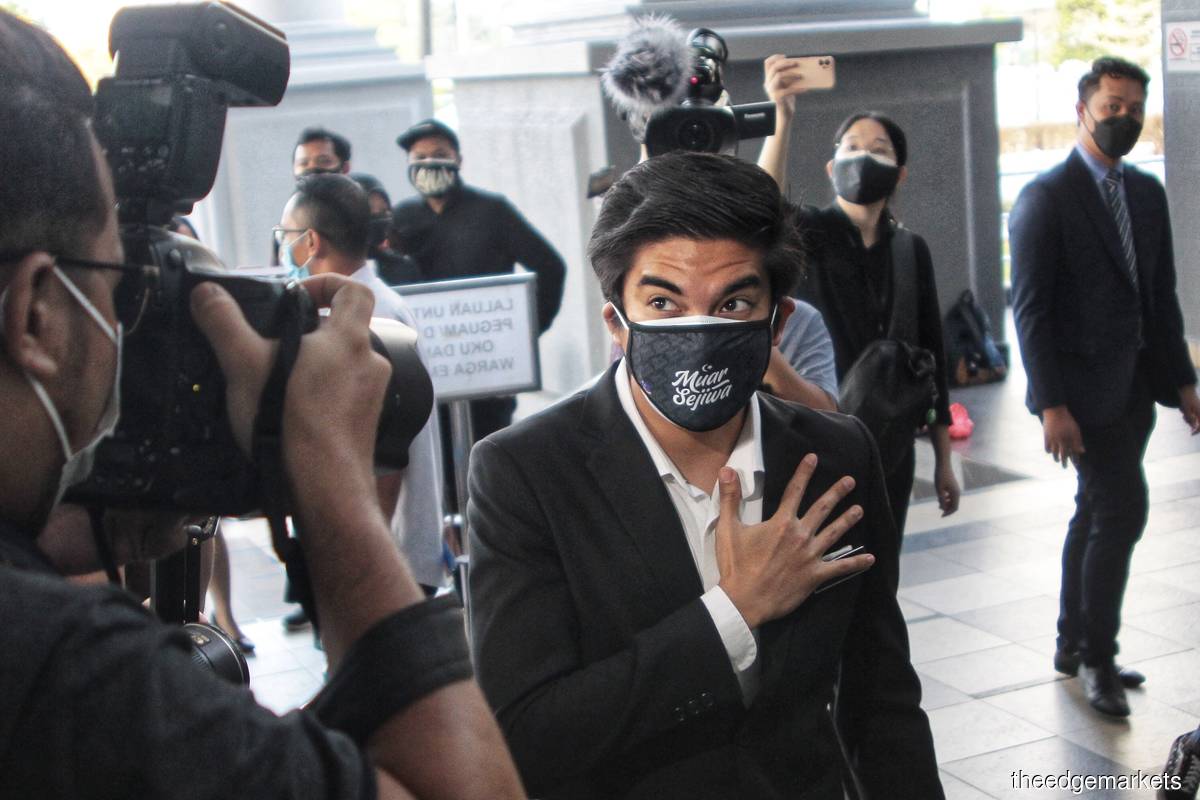 The judge has ordered Syed Saddiq (centre) to surrender his passport to the court, and to report to the nearest MACC office in Kuala Lumpur once a month, until disposal of the case. (Photo by Zahid Izzani Mohd Said/The Edge)